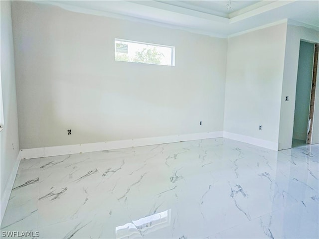 4111 22nd St SW, Lehigh Acres, FL 33976 - empty room with baseboards, marble finish flooring, and crown molding