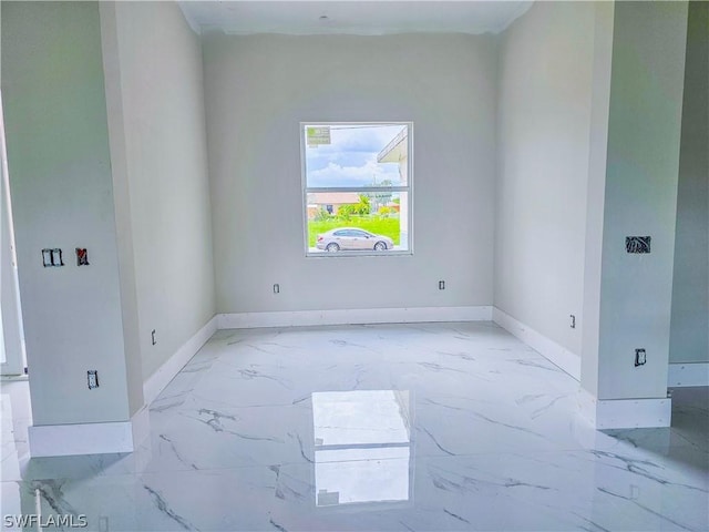 4111 22nd St SW, Lehigh Acres, FL 33976 - empty room with baseboards and marble finish floors