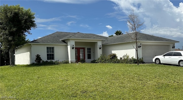 single story home with a front lawn and a garage