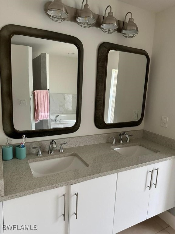 bathroom with tile patterned flooring and vanity