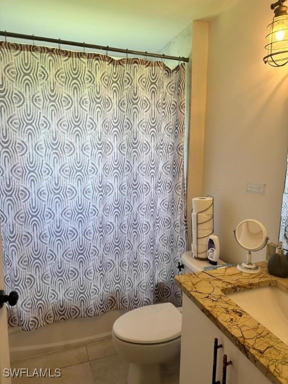 full bathroom with tile patterned flooring, vanity, toilet, and shower / tub combo with curtain