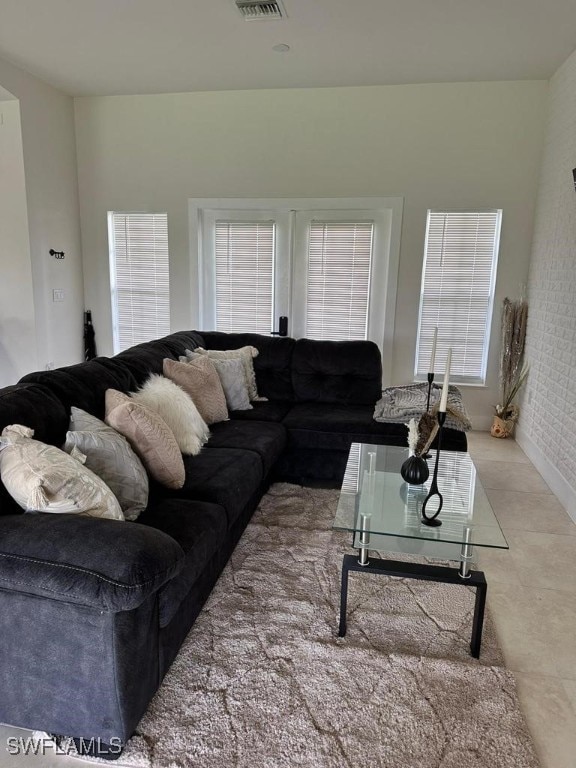 living room with tile patterned flooring