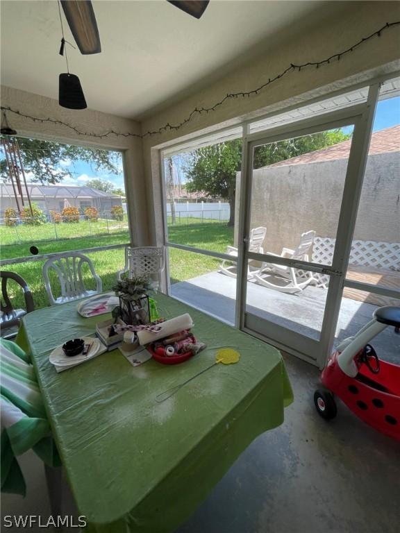 sunroom / solarium with ceiling fan