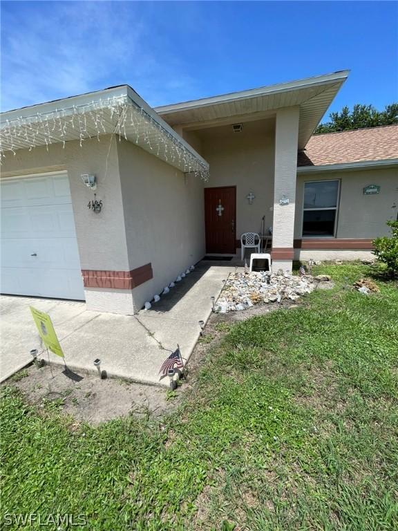 view of exterior entry featuring a garage