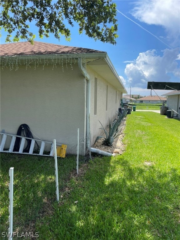 view of property exterior with a lawn