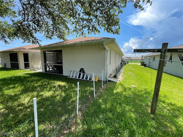 view of home's exterior with a lawn