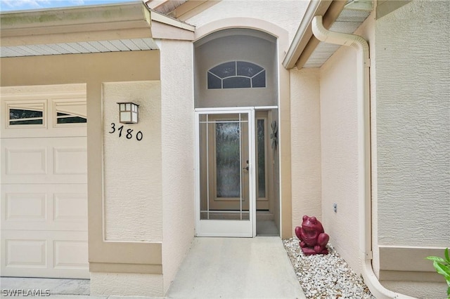 property entrance with a garage