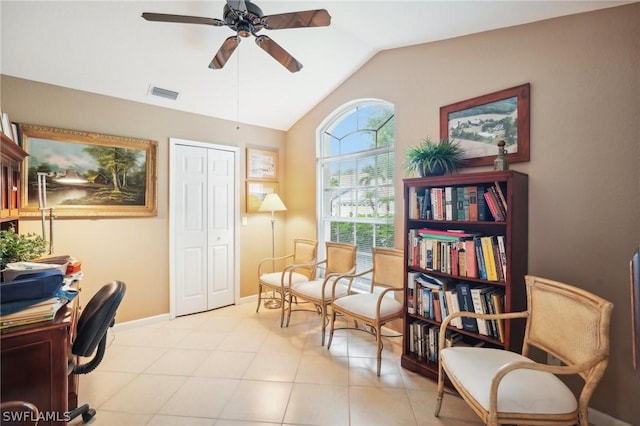 home office with vaulted ceiling, light tile patterned flooring, and ceiling fan