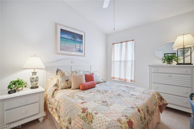 bedroom featuring lofted ceiling, light colored carpet, and ceiling fan