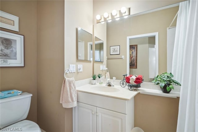 bathroom with vanity and toilet