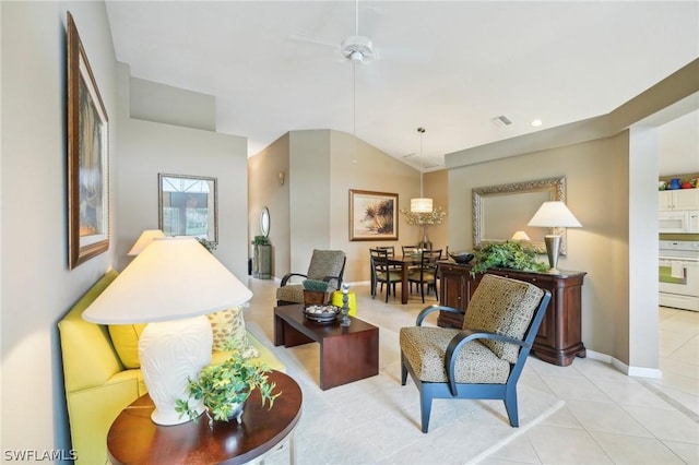 tiled living room featuring ceiling fan and lofted ceiling