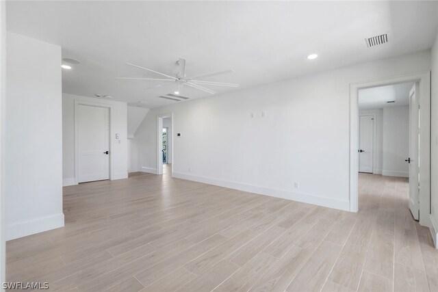 unfurnished room with light wood-type flooring and ceiling fan