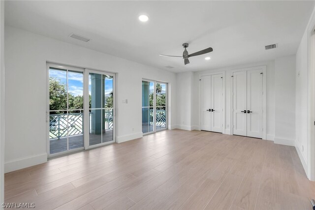 interior space with ceiling fan and light wood-type flooring