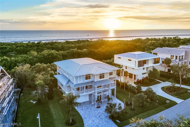 aerial view at dusk with a water view