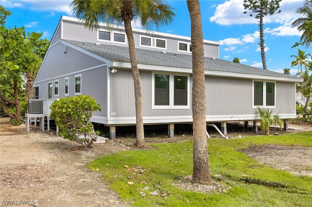 back of house featuring central AC