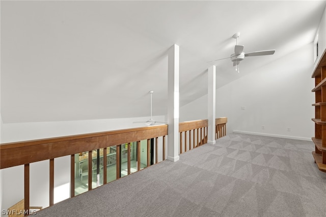 additional living space featuring ceiling fan, light carpet, and lofted ceiling