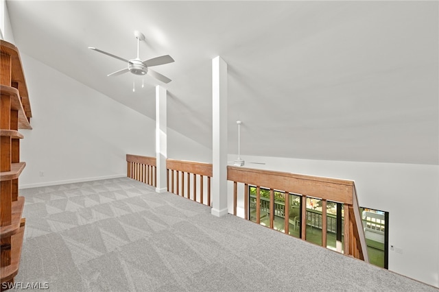 additional living space with lofted ceiling, light colored carpet, and ceiling fan