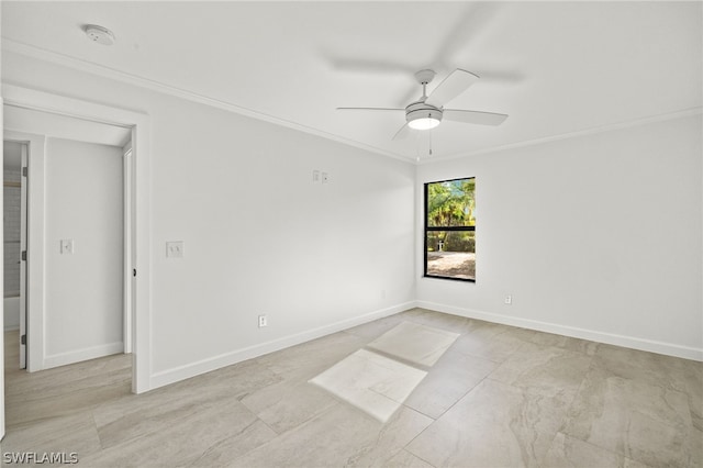 spare room with ceiling fan and crown molding