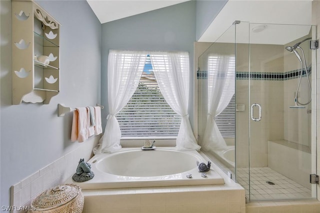 bathroom with independent shower and bath and lofted ceiling