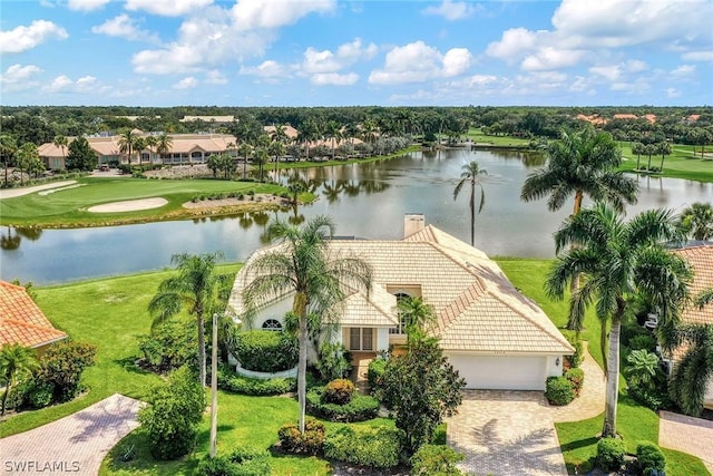 birds eye view of property with a water view