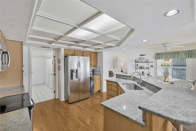 kitchen featuring ceiling fan, stainless steel fridge with ice dispenser, sink, coffered ceiling, and light hardwood / wood-style flooring