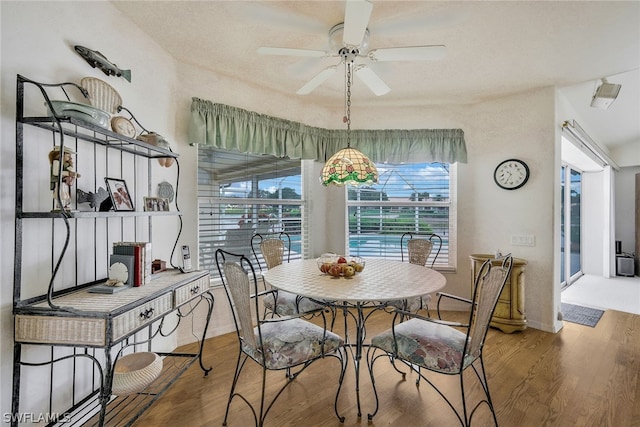 dining space featuring hardwood / wood-style flooring and ceiling fan