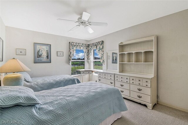 bedroom featuring light carpet and ceiling fan