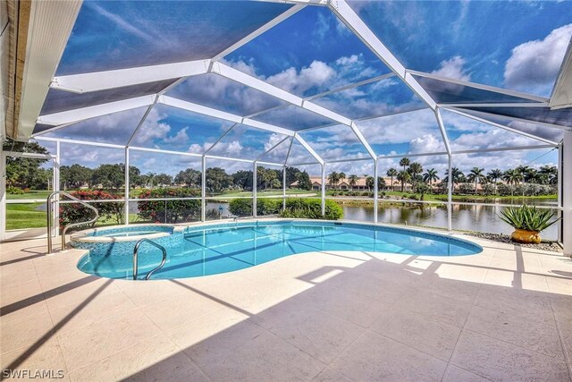 view of pool with a patio area and glass enclosure