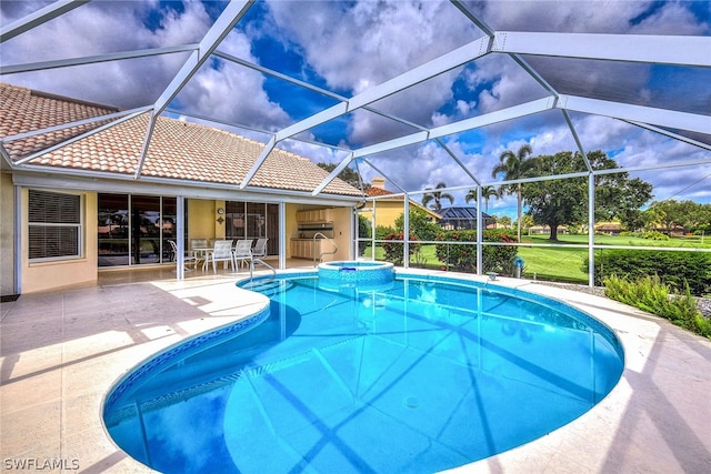 view of swimming pool featuring an in ground hot tub, a patio, area for grilling, and a lanai