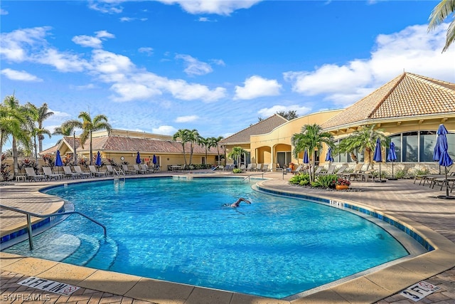 view of swimming pool with a patio area