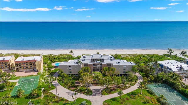 bird's eye view with a water view and a view of the beach