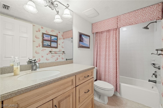 full bathroom with tile patterned flooring, vanity, toilet, and shower / bath combo with shower curtain