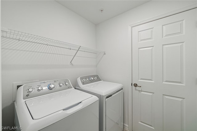 laundry area with washer and clothes dryer