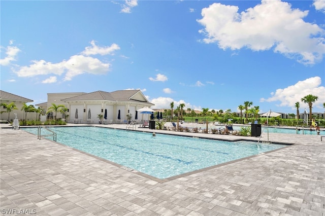 view of swimming pool featuring a patio area