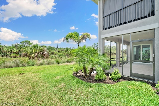 view of yard with a sunroom