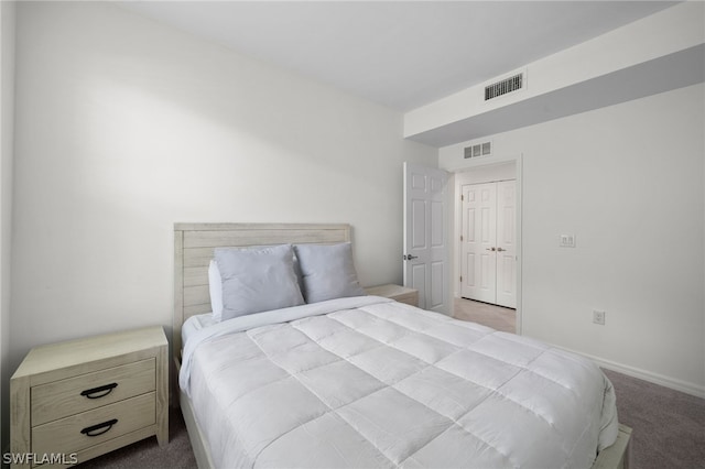 bedroom featuring light colored carpet