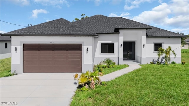 view of front of house featuring a garage and a front lawn