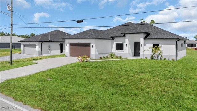 817 Jacaranda Pkwy E, Cape Coral, FL 33909 - prairie-style house featuring a front yard, stucco siding, a shingled roof, an attached garage, and driveway