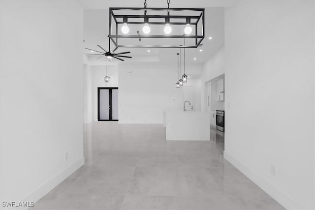 817 Jacaranda Pkwy E, Cape Coral, FL 33909 - hallway with baseboards, a sink, a towering ceiling, and recessed lighting