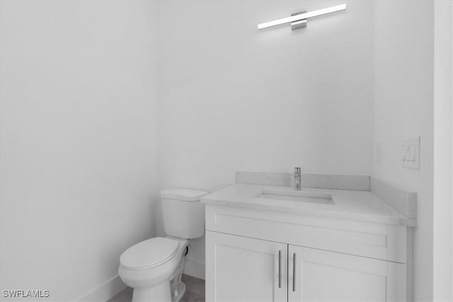 817 Jacaranda Pkwy E, Cape Coral, FL 33909 - bathroom with vanity, baseboards, and toilet