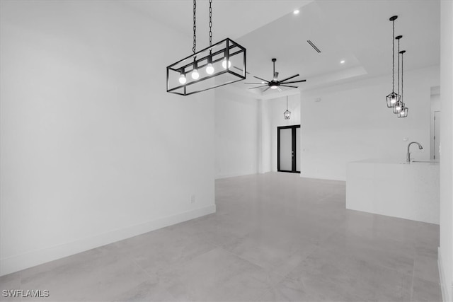 unfurnished room with a tray ceiling