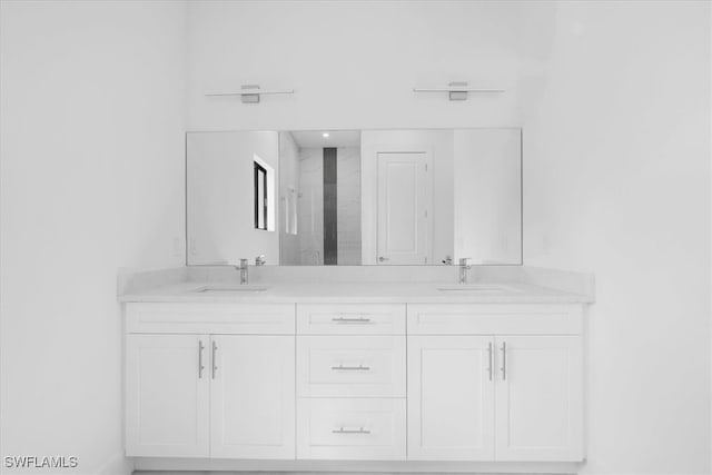 bathroom featuring vanity and an enclosed shower