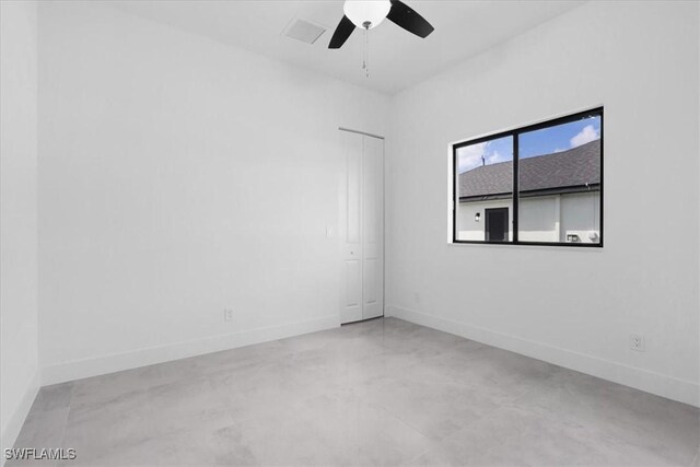 817 Jacaranda Pkwy E, Cape Coral, FL 33909 - empty room with baseboards, a ceiling fan, concrete floors, and visible vents
