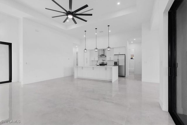 817 Jacaranda Pkwy E, Cape Coral, FL 33909 - unfurnished living room with a ceiling fan, recessed lighting, and a raised ceiling