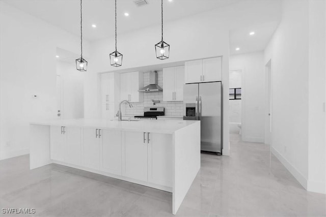 817 Jacaranda Pkwy E, Cape Coral, FL 33909 - kitchen featuring light countertops, wall chimney exhaust hood, white cabinetry, a sink, and appliances with stainless steel finishes