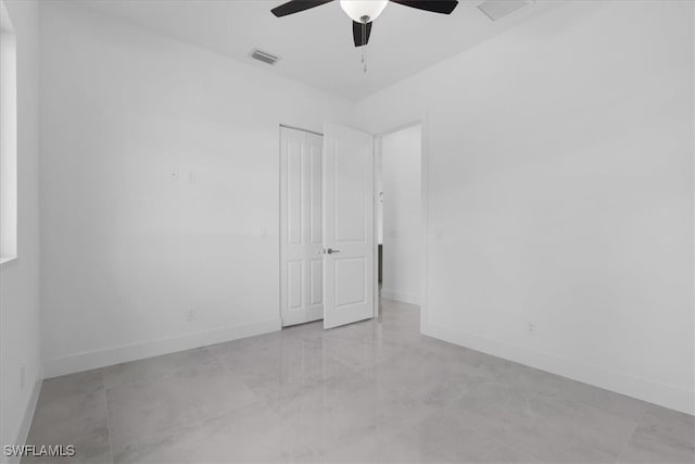 spare room with ceiling fan