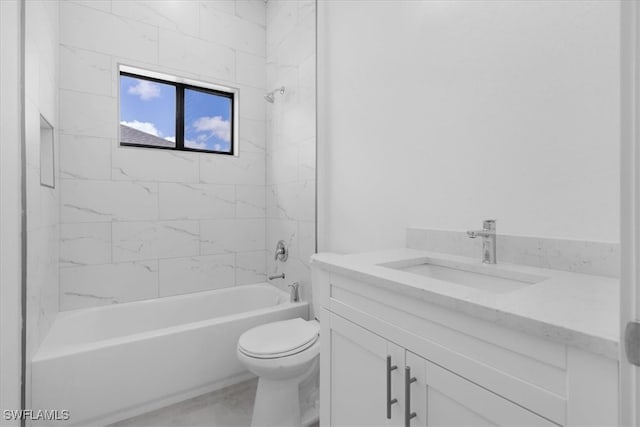 full bathroom featuring vanity, toilet, and tiled shower / bath