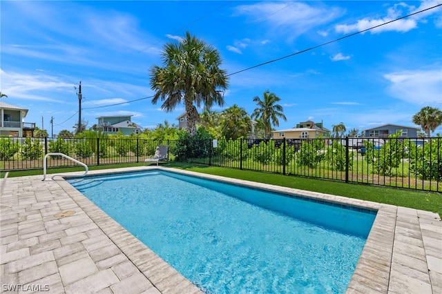 view of swimming pool featuring a patio area