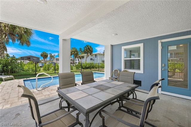 view of patio featuring a fenced in pool