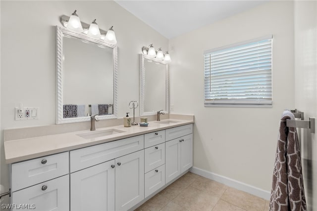 bathroom with tile patterned flooring and vanity